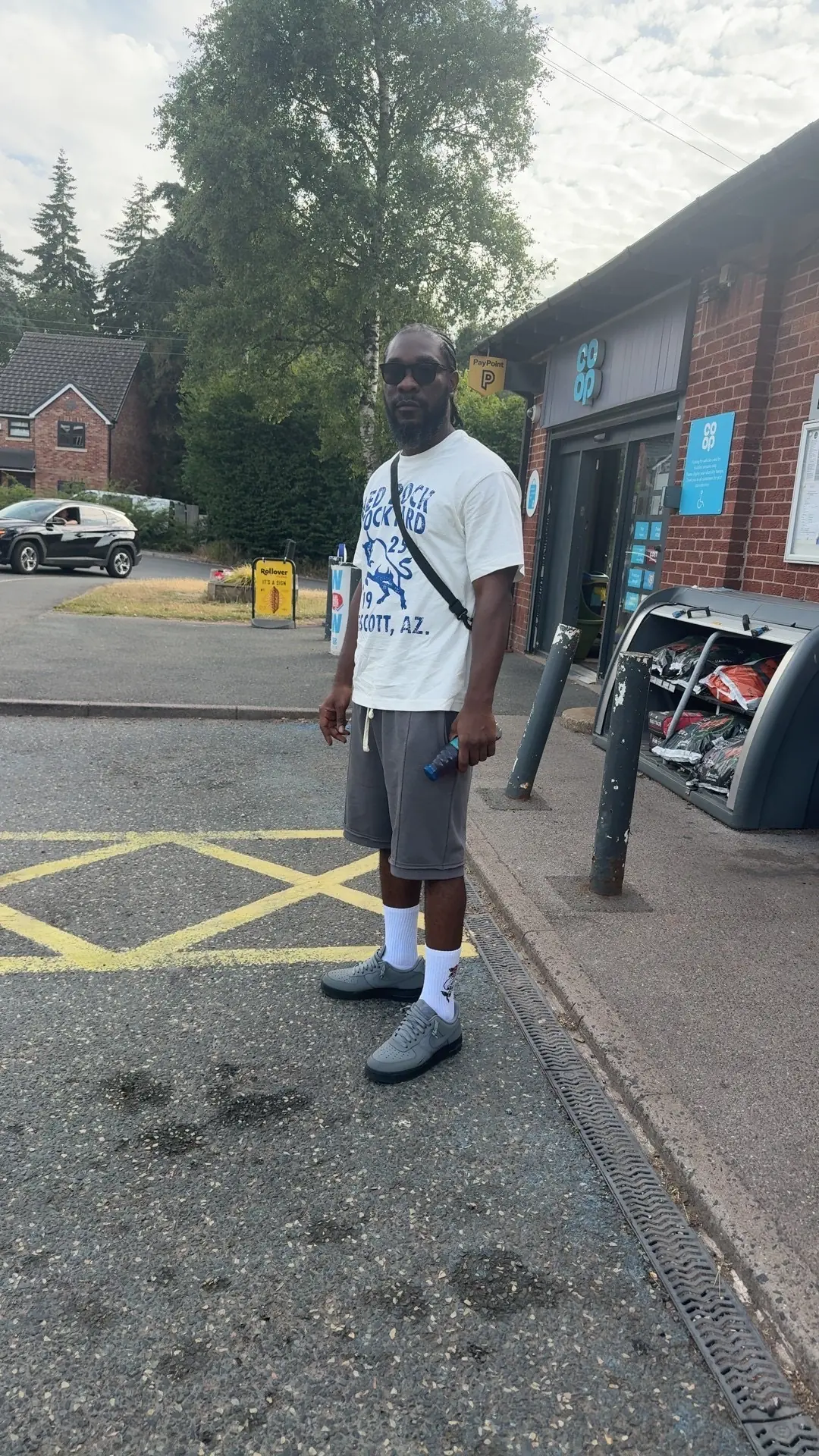 Kobby Major standing on a city street