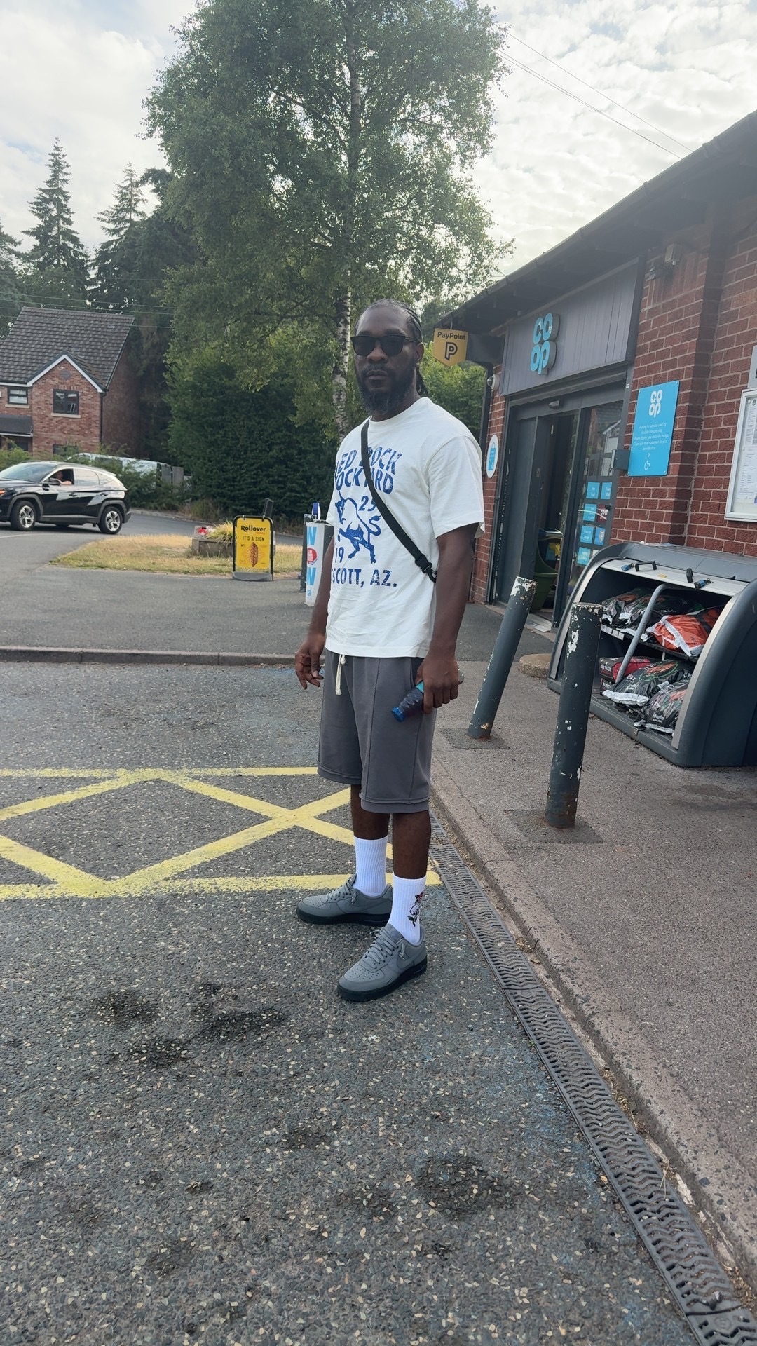 Kobby Major standing on a city street